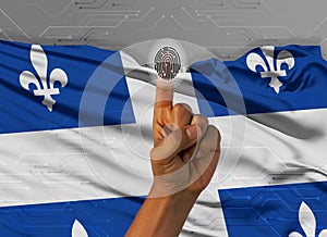 Digital ID Quebec on finger of dark skin person and Canadian province flag on background
