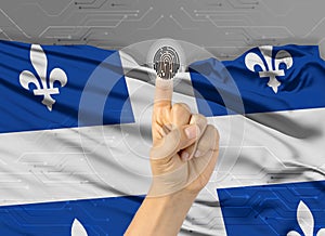 Digital ID Quebec on finger of white skin person and Canadian province flag on background