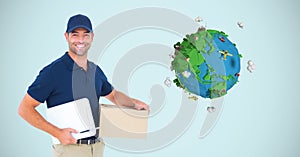 Digital image of delivery man holding box and writing pad while standing by planet earth against blu