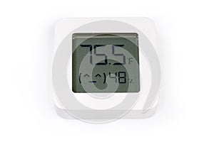 Digital indoor mini thermometer with hygrometer on a white surface