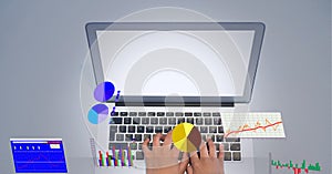 Digital interface with statistical data processing against mid section of person using laptop