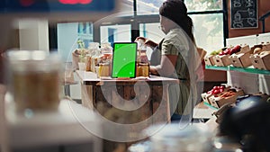 Digital layout of greenscreen on tablet placed in farmers market