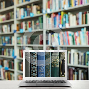 Digital library concept. Modern laptop on table