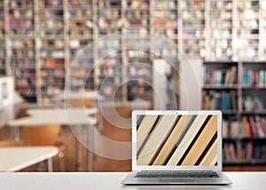 Digital library concept. Modern laptop on table indoors, space for text