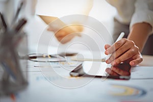 Digital marketing, businessman using digital tablet and documents on office desk background.