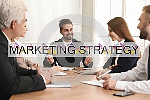 Digital marketing strategy. Team of professionals working together at table