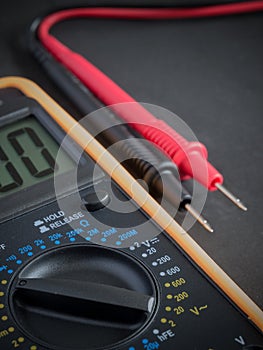 Digital Multimeter on black background close up