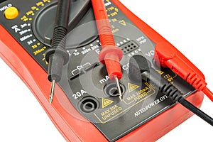 Digital multimeter with probes isolated on a white background