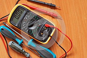 Digital multimeter and screwdrivers