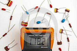 Digital multimeter showing a voltage reading on its display