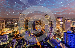 Digital network connection lines of Sathorn, Bangkok Downtown, skyline of Thailand. Financial district and business centers in