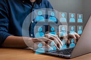 Digital Networking Interface with Highlighted User Icon and Laptop Typing