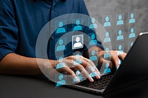 Digital Networking Interface with Highlighted User Icon and Laptop Typing