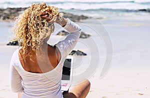 Digital nomad happy lifestyle and people smart working everywhere with roaming and connection technology - beautiful blonde curly