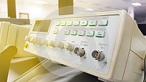 Digital oscilloscope in the foreground in the background