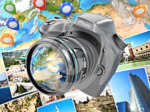 Digital photo camera on background from earth and photographs.