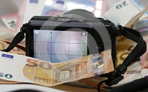 Digital Photography Camera on the background of money.