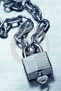 Digital security and encryption concept showing binary code overlaid on chain with steel padlock and key on scratched steel