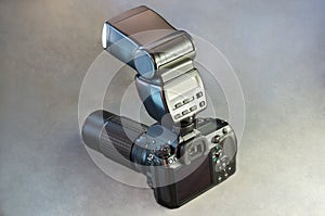 Digital SLR Camera Body Lens and Flash on Gray