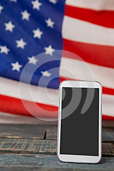 Digital tablet on American flag