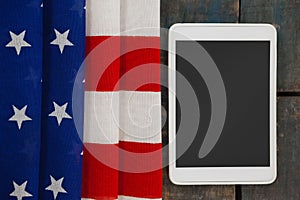 Digital tablet on American flag