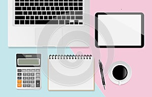 Digital tablet with blank screen and notebook, pen, black metallic paper clips, calculator, coffee cup, eyeglasses and laptop on