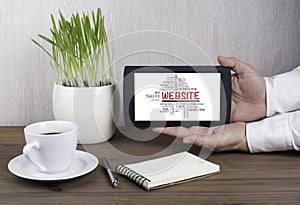 Digital tablet computer in male hands - website concept