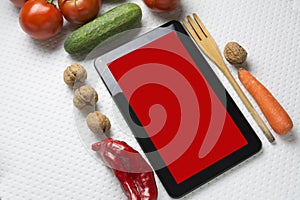 Digital tablet with fresh vegetables