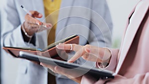 Digital tablet, hands and business people writing in meeting for creative, planning and strategy in office. Closeup