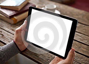 Digital tablet in male hands over background