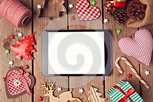 Digital tablet mock up with rustic Christmas decorations for app presentation