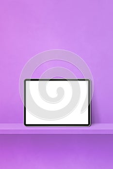 Digital tablet pc on purple wall shelf. Vertical background banner
