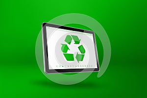 Digital tablet PC with a recycling symbol on screen. environmental conservation concept