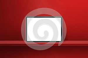 Digital tablet pc on red wall shelf. Horizontal background banner