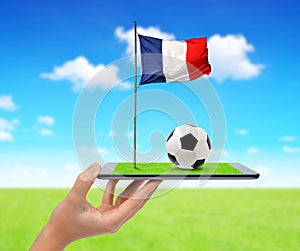 Digital tablet pc with soccer ball and French flag