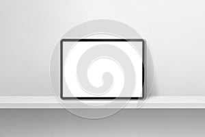 Digital tablet pc on white wall shelf. Horizontal background banner