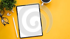 Digital tablet touchpad mockup and copy space on yellow background