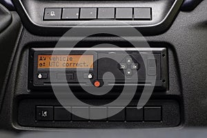 Digital tachograph display reads Vehicle UTC Correct. No personal data. Tachograph in a van photo