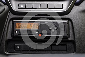 Digital tachograph display shows the 11 hour day break. Starting new shift. No personal data. Tachograph in a van