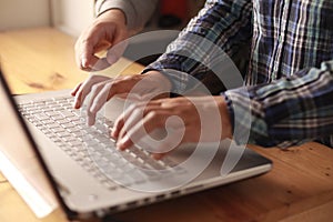 Digital team working on computer laptop, two programmer doing web internet technology project, discussion and typing at office