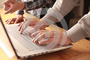 Digital team working on computer laptop, two programmer doing web internet technology project, discussion and typing at office