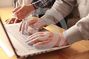 Digital team working on computer laptop, two programmer doing web internet technology project, discussion and typing at office