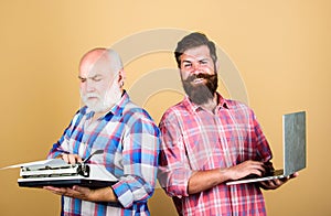 Digital technologies. bearded men. Vintage typewriter. technology battle. Modern life. father and son. family generation