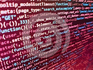 Digital technology on display. Simple website HTML code with colourful tags in browser view on dark background. Data encryption
