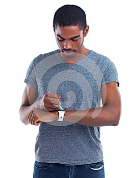 Digital technology just gets smarter and smarter. Cropped view of a young man wearing a smartwatch with a digital