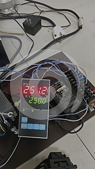 Digital Temperature Controller Displaying 25.12 Degrees Celsius
