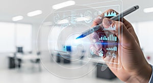 Digital transformation concept hand holding stylus interacting with futuristic abstract data visualization screen