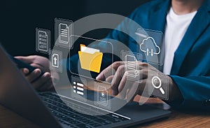 Digital transformation and data management concept.Businessman use laptop to interface with cloud computing and document