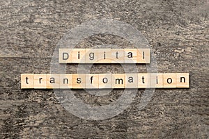 digital transformation word written on wood block. digital transformation text on cement table for your desing, concept