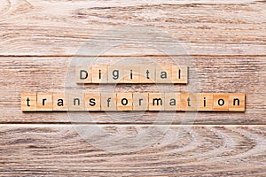 Digital transformation word written on wood block. digital transformation text on wooden table for your desing, concept